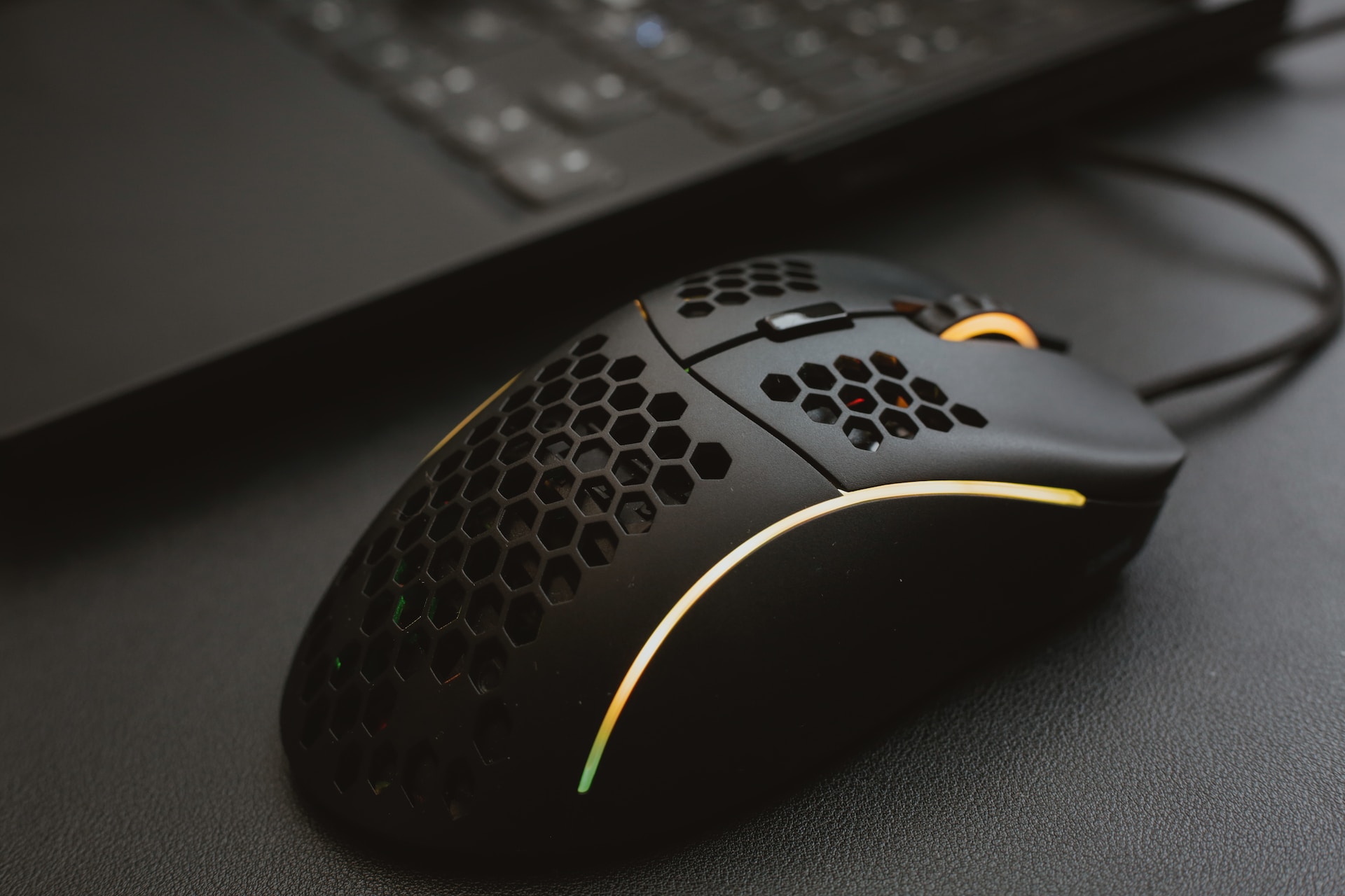 Gaming mouse with holes